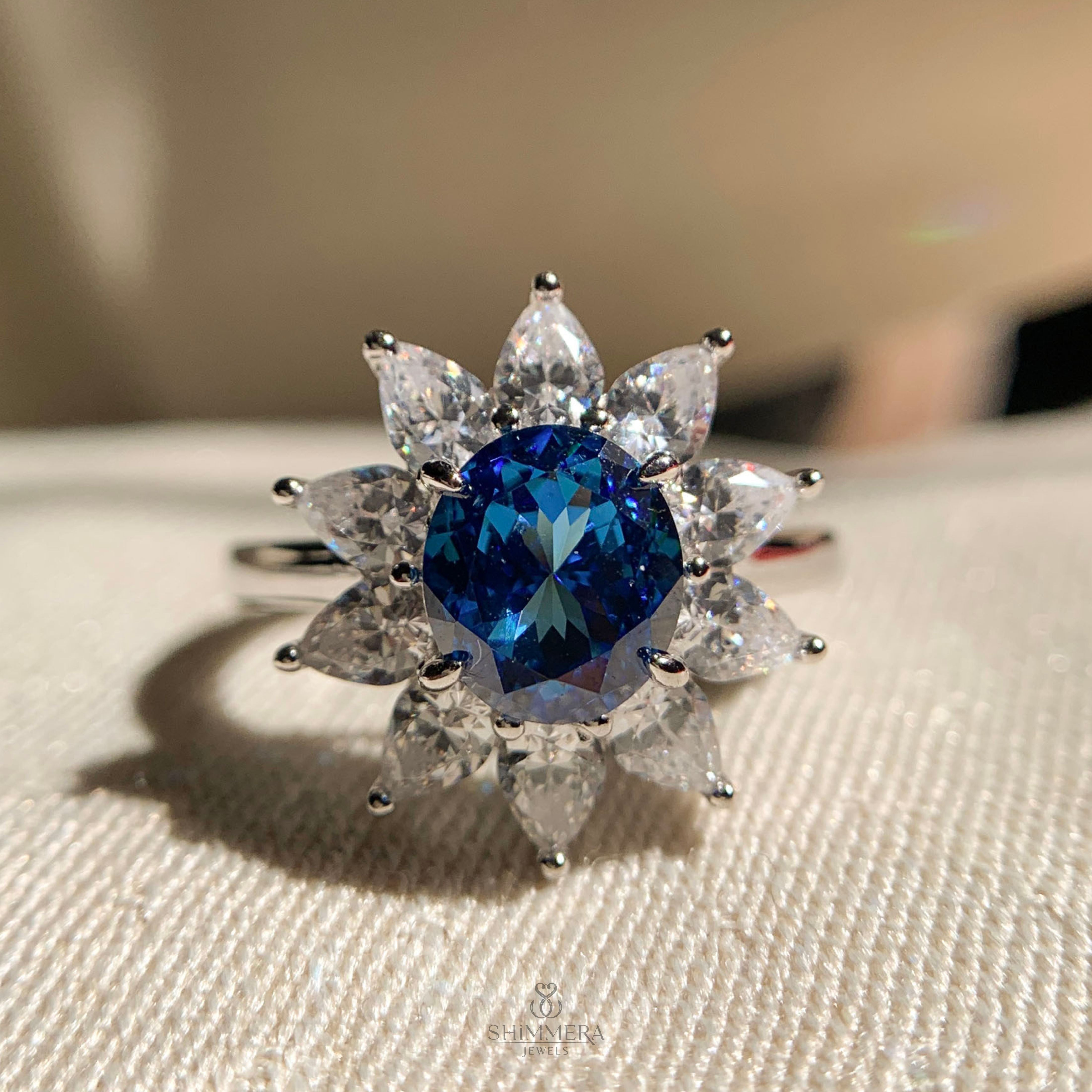 Oval Cut Engagement Rings with Blue Sapphires and White Pear